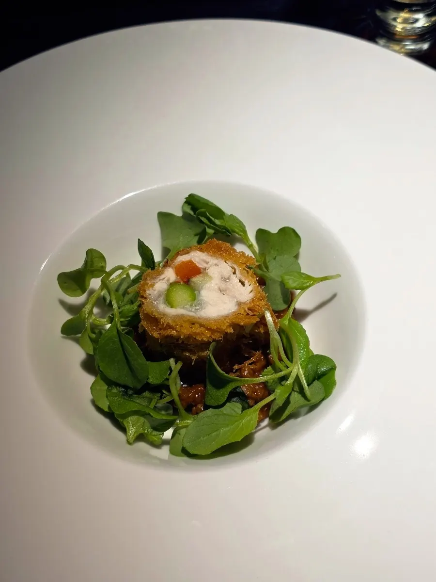 Signature dish of chicken tenderloin and vegetables with Okinawan taco sauce