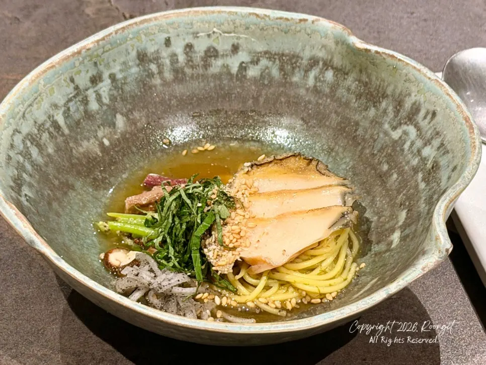 Cross-section of hanwoo tteokgalbi with basil oil