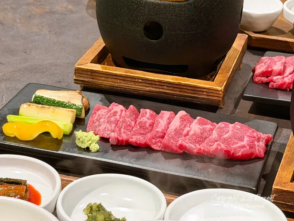 Hanwoo sirloin grilled on a personal charcoal grill