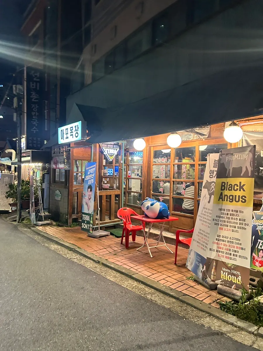 View of the bustling Dohwa-dong alley crowded with customers