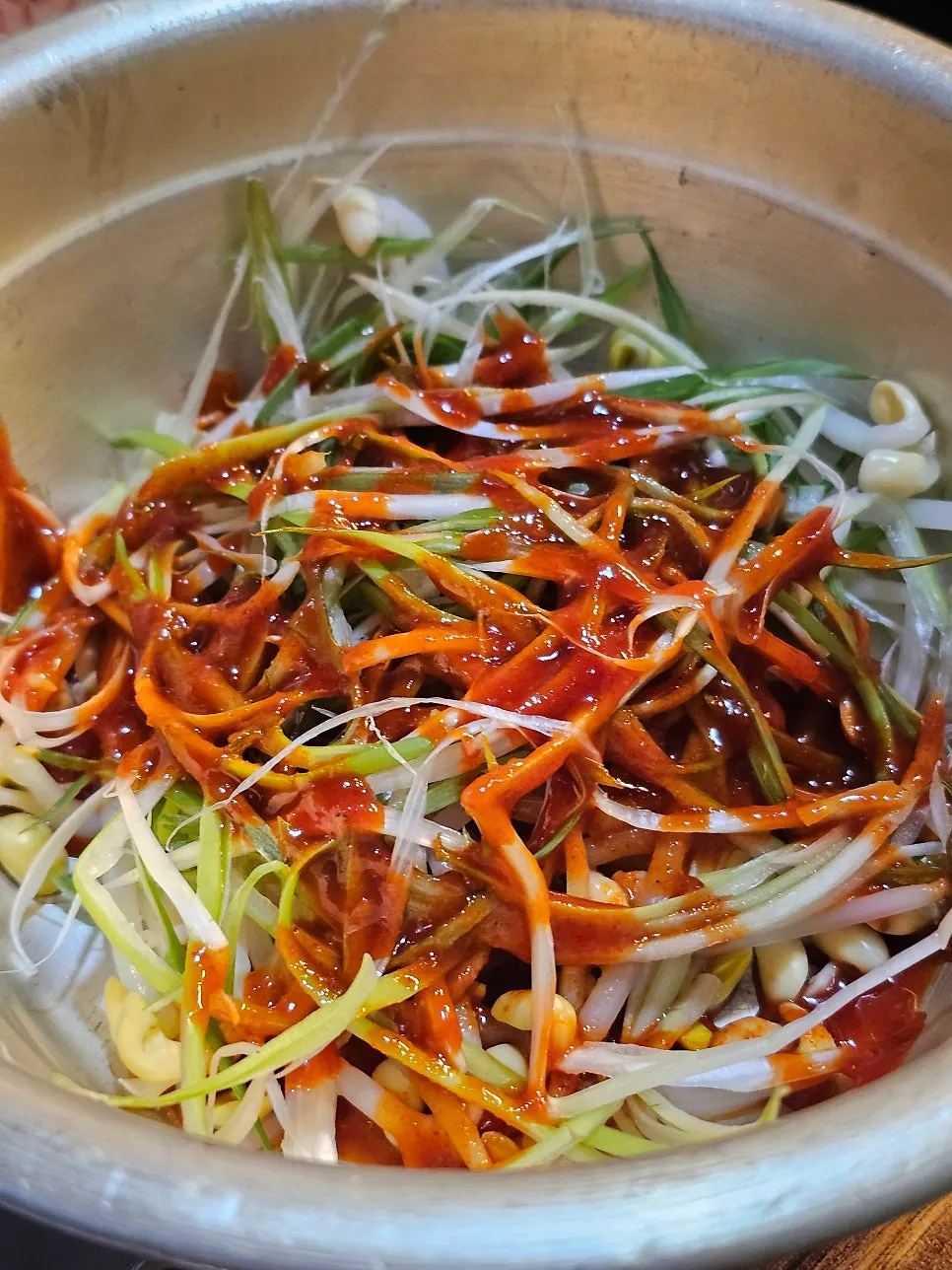 Shredded green onion eaten alongside the meat