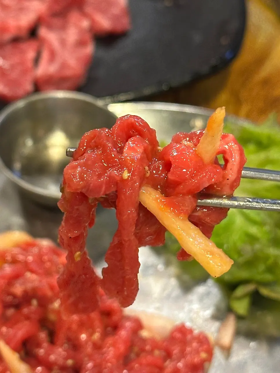 Beef tartare mixed with pear on a plate