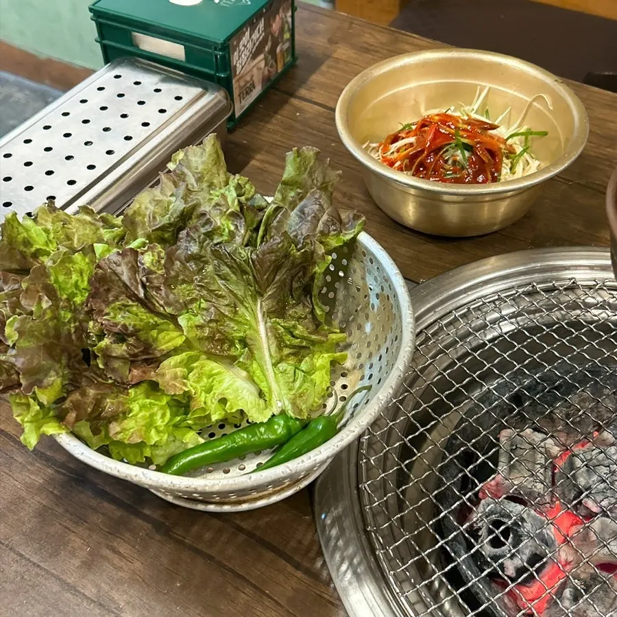 Basic side dish spread including pickled onion and cabbage salad