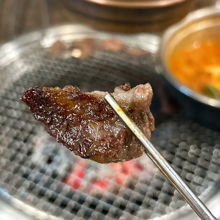 Plain rib meat grilled golden on the outside over charcoal