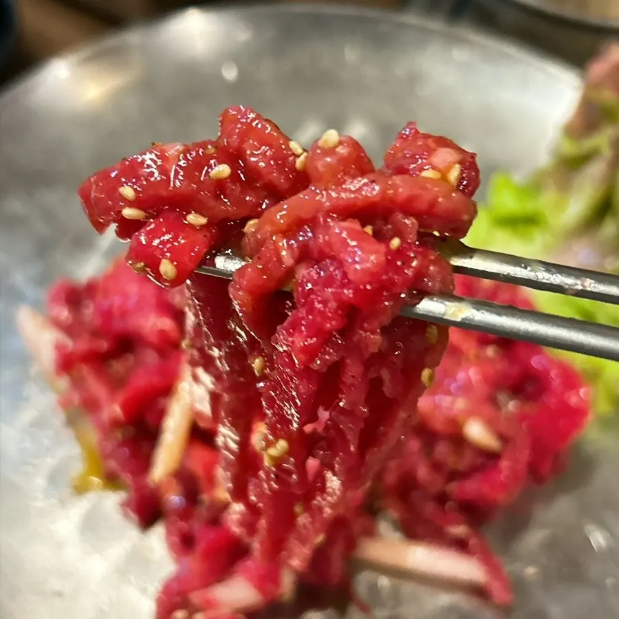 Beef tartare mixed together with the egg yolk