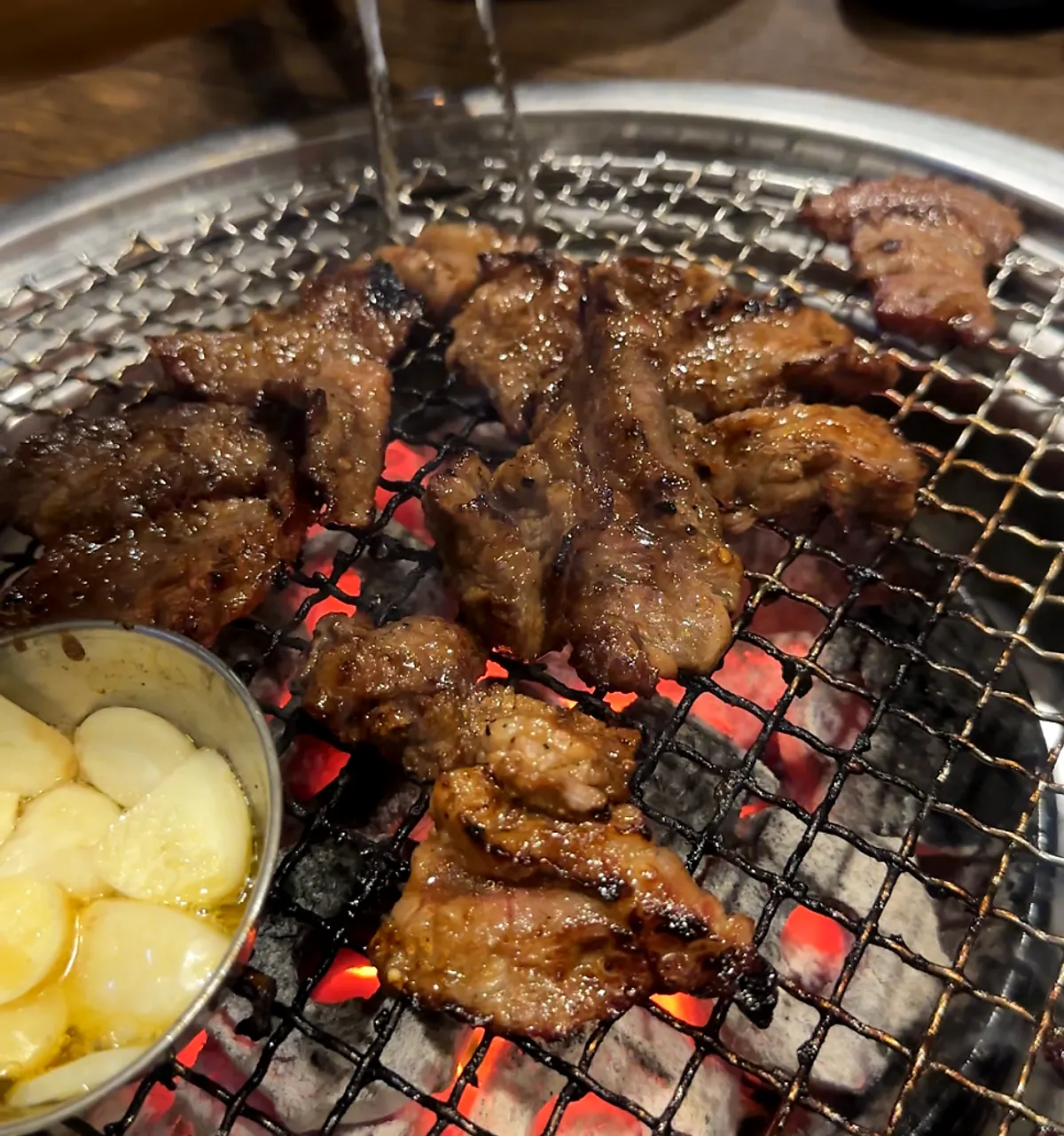Marinated hwangje galbisal grilling over charcoal at Mapo Mokjang near Mapo Station