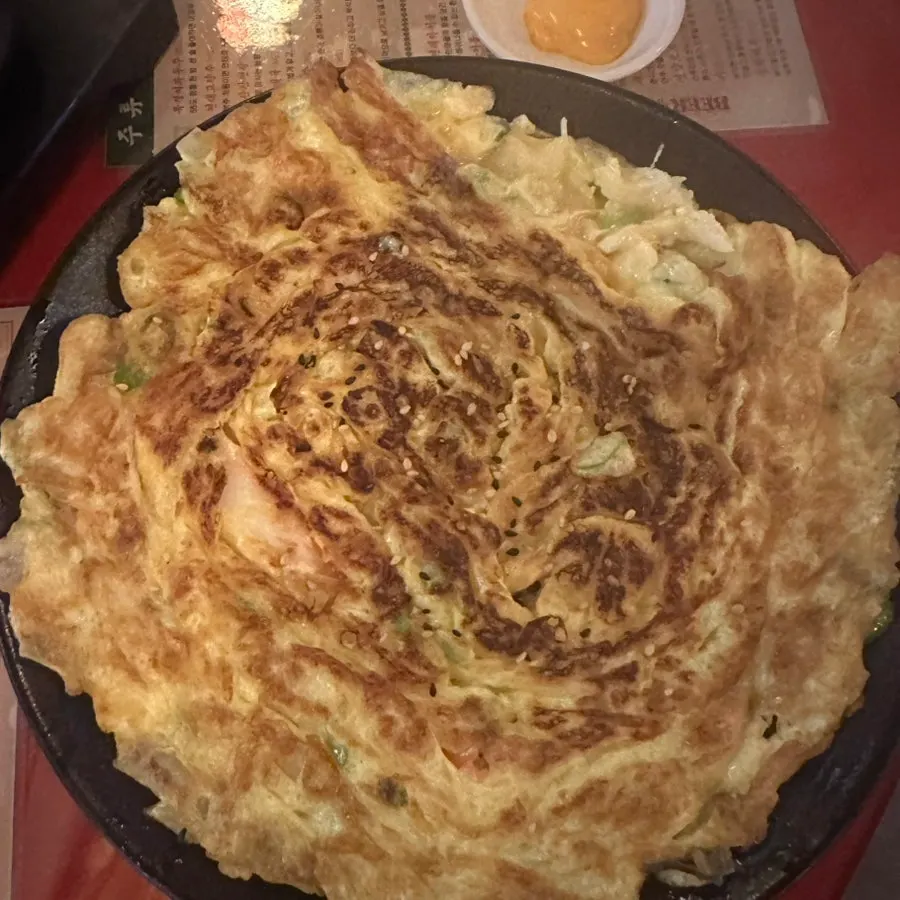 Chinese omelet topped with shrimp