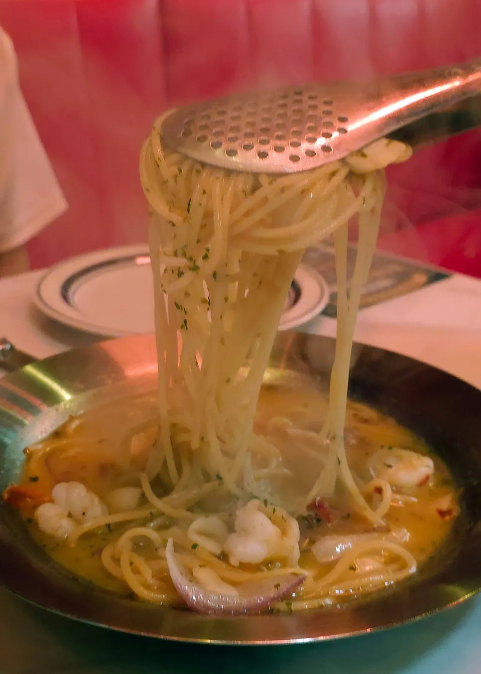 A plate of Raccoon Pizza's vongole pasta
