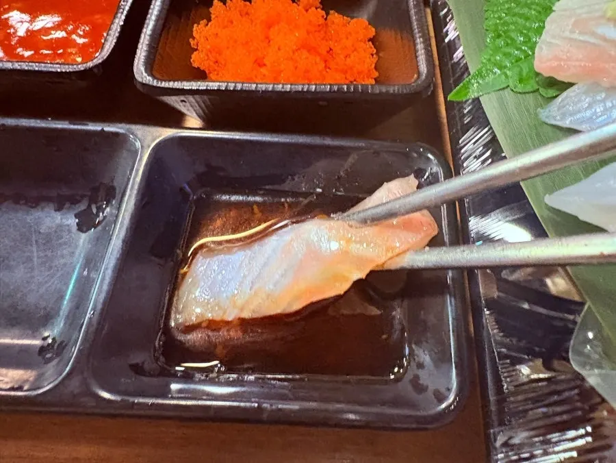 A full spread of raw shrimp and flounder sashimi