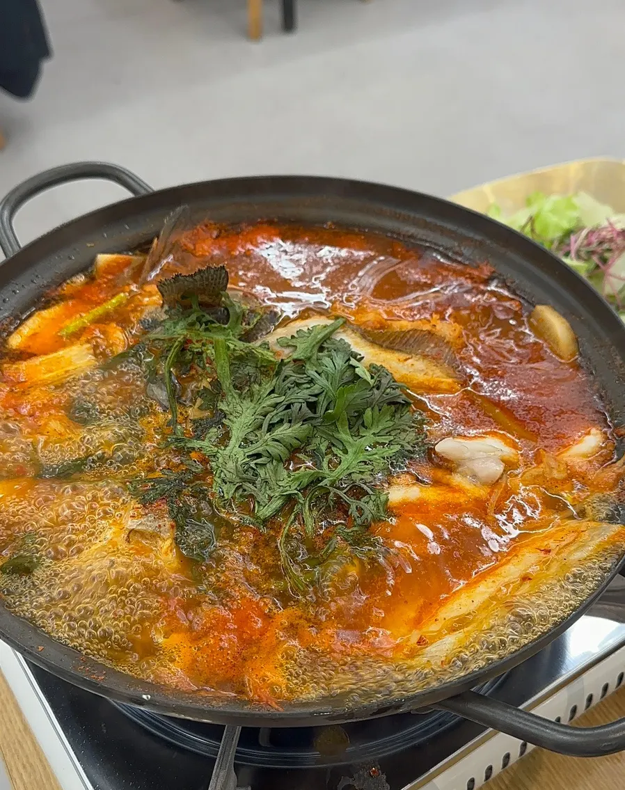 Pot of spicy complimentary fish stew