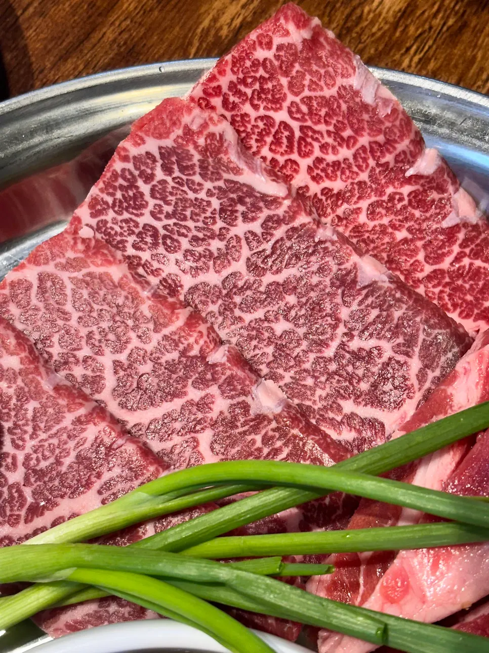 Plate of grilling beef with deep marbling
