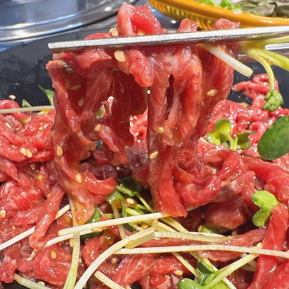 Yukhoe (raw beef) topped with egg yolk at Usijang Hoegwan