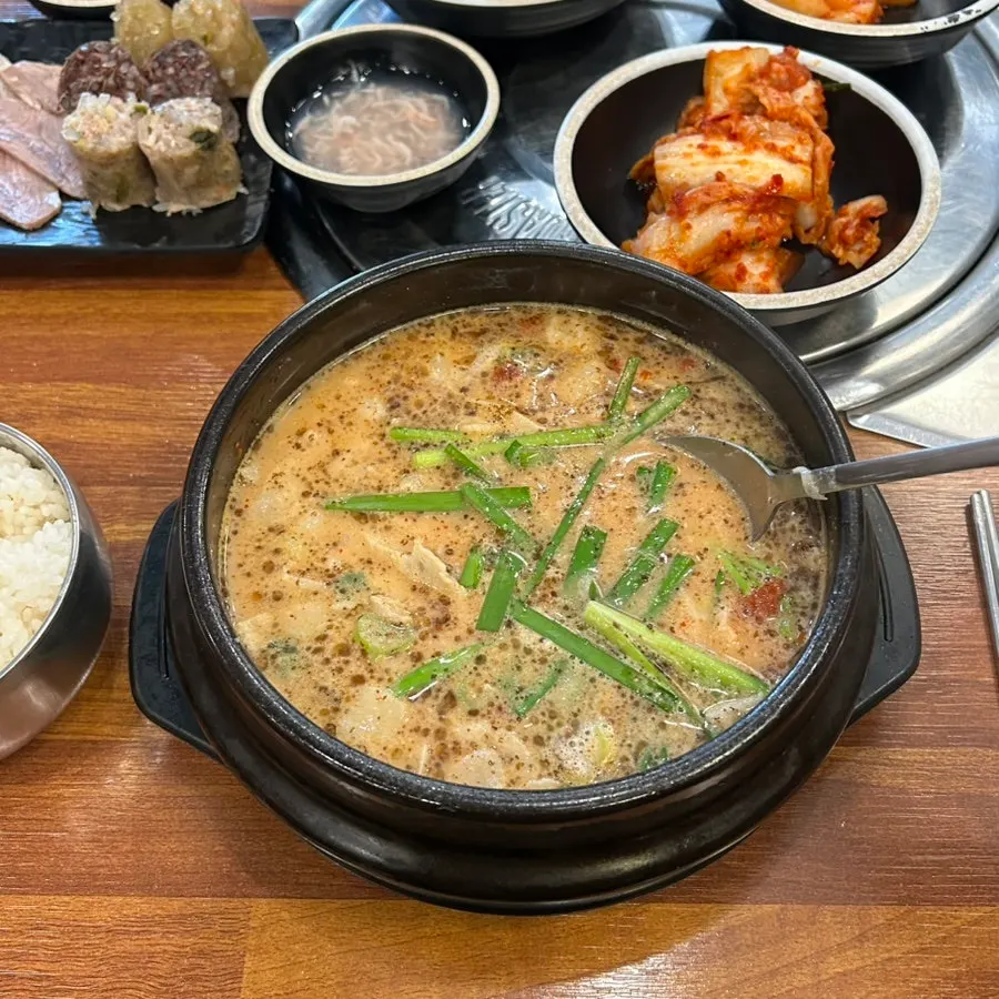 Suyuk gukbap showing the rich broth and pork neck