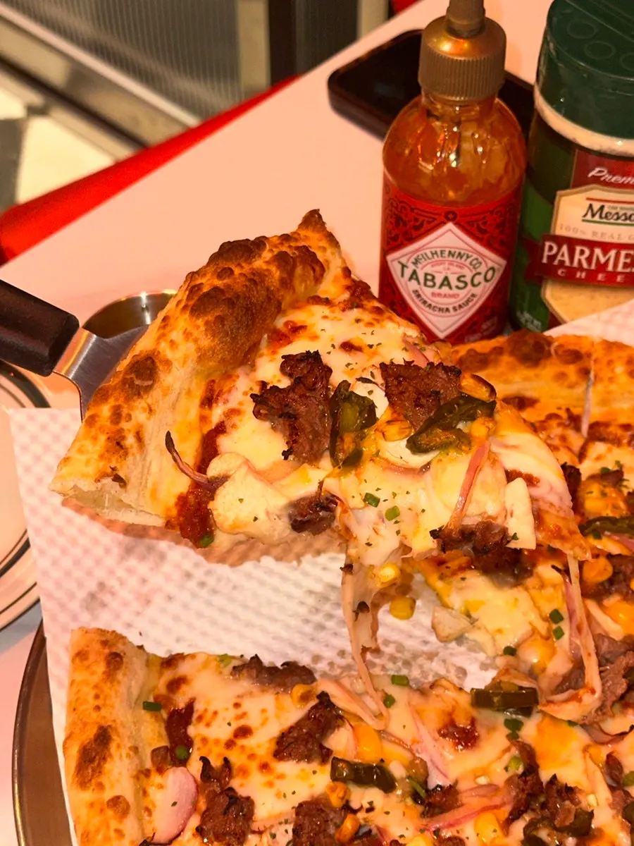 Table setup with Bulgogi Premium pizza and crispy hot chicken