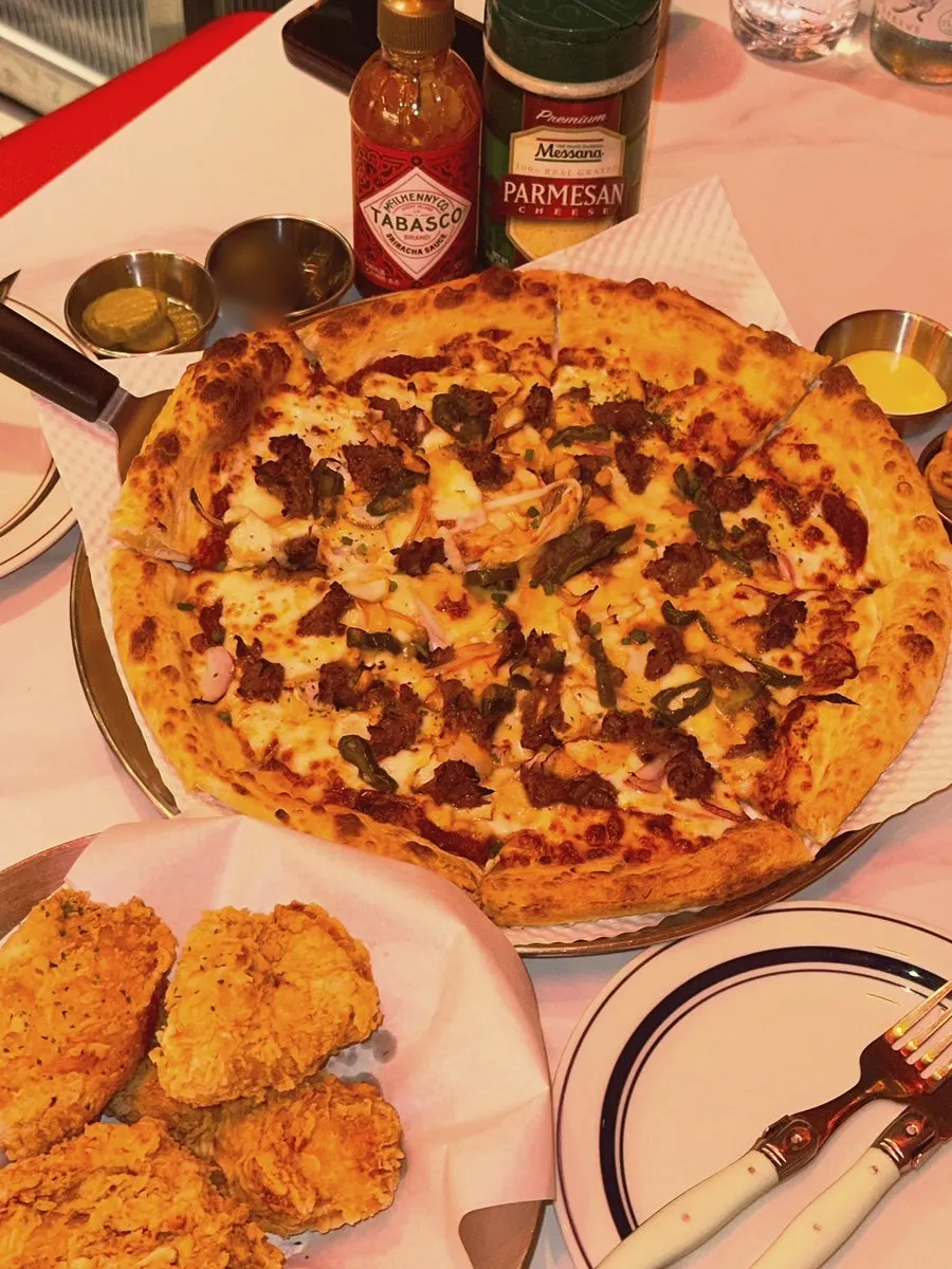 A slice of bulgogi pizza with stretching cheese