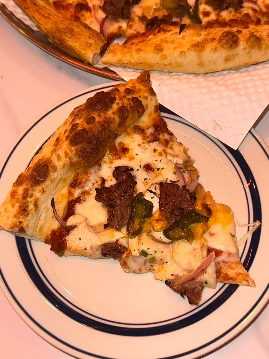 Pizza crust dipped into sauce