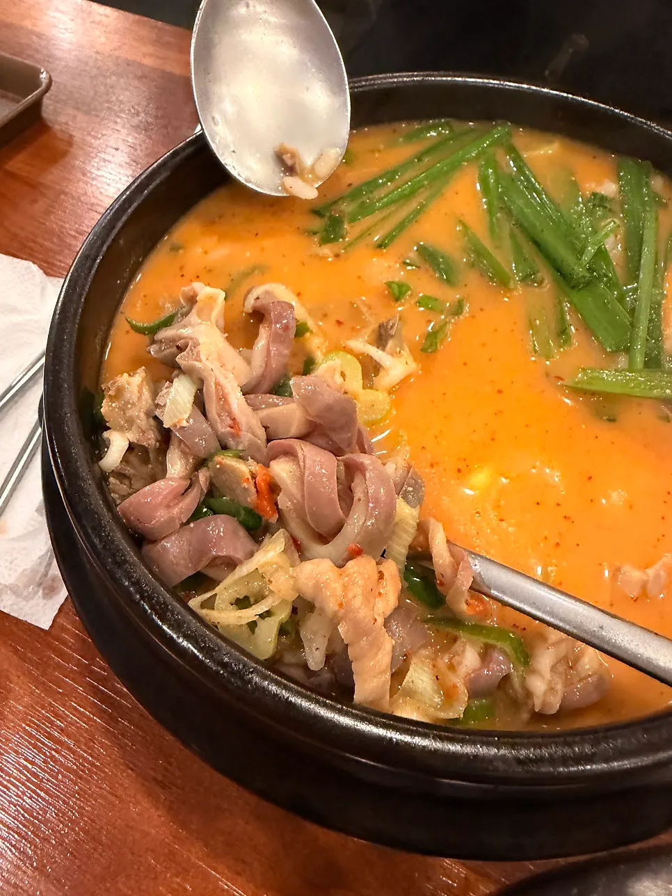 Vertical shot of the clean, light gukbap broth