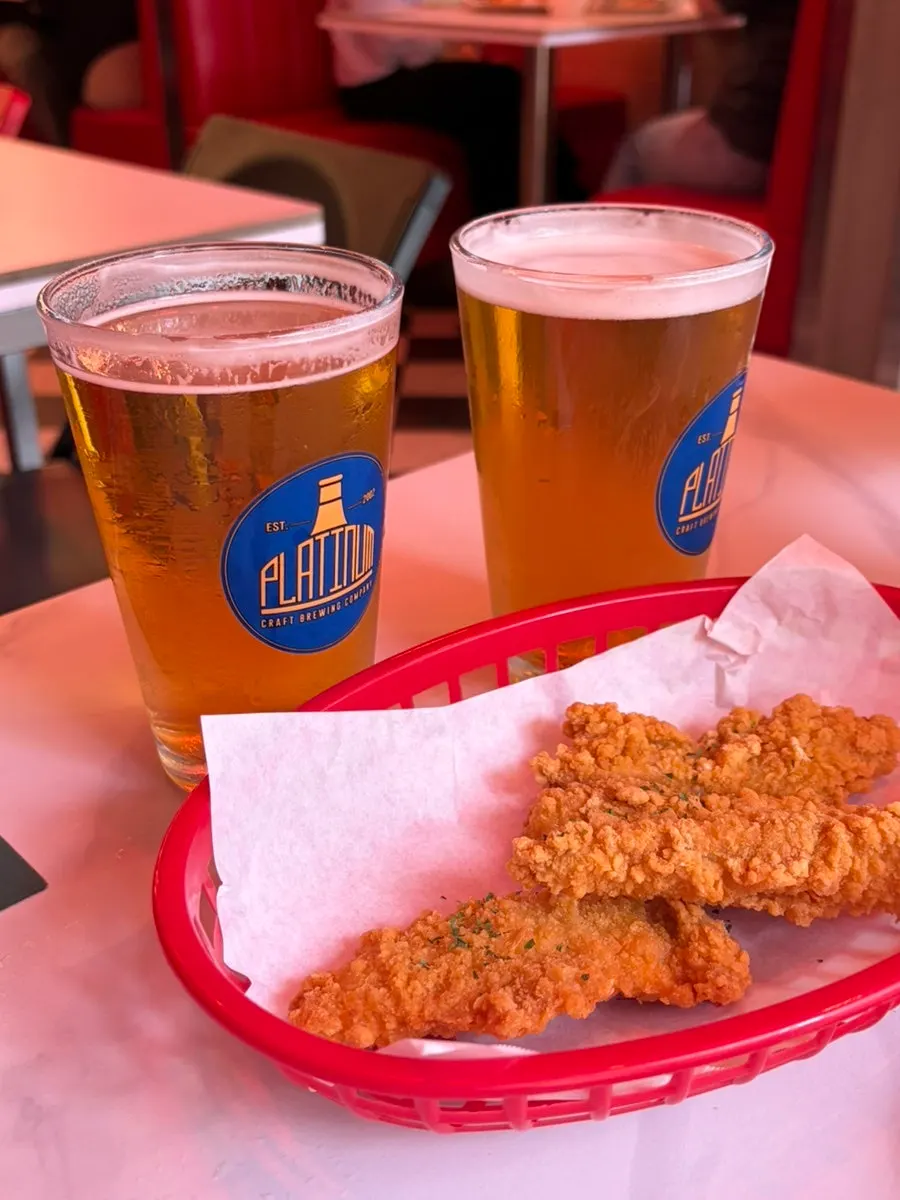 A glass of draft beer at Raccoon Pizza Mapo Station branch