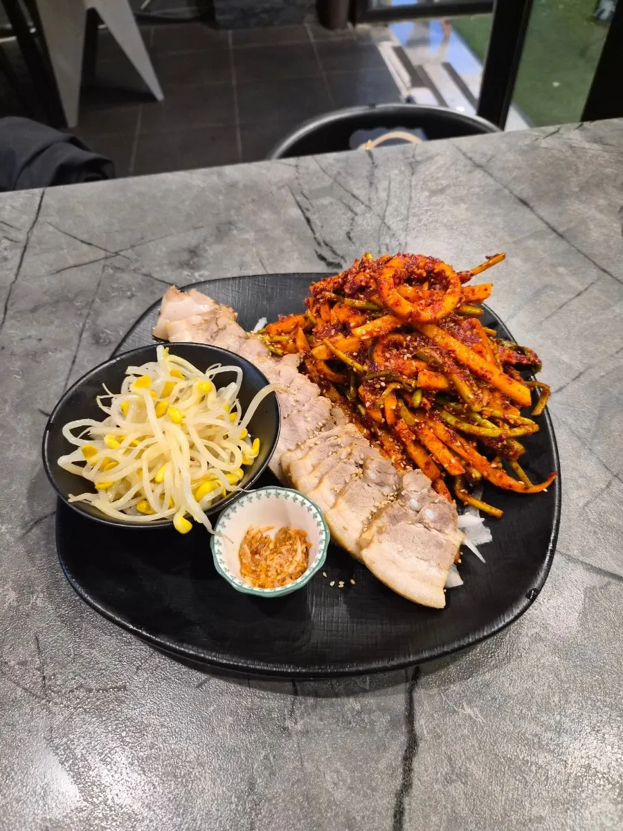 Bossam set served with bean sprouts and sauce
