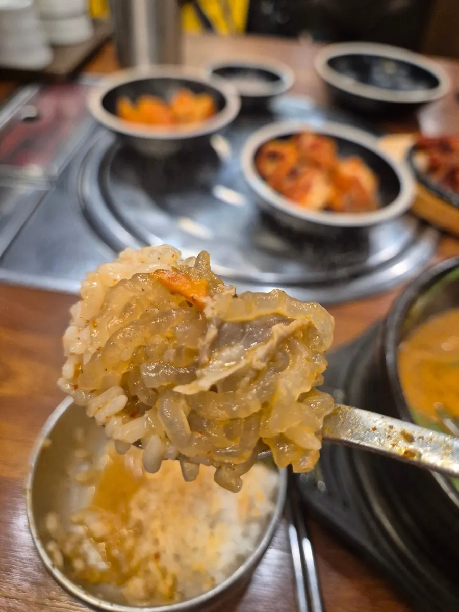 Evening table setting with sundaeguk-bap and side dishes