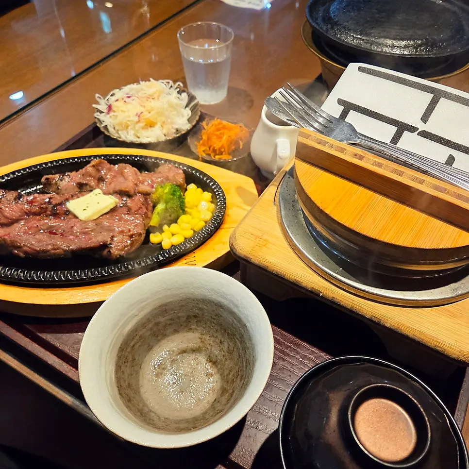 Sizzling steak with steak sauce