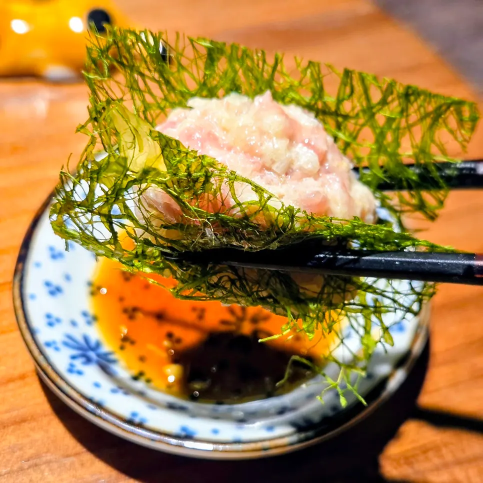 A piece of sushi hand-pressed right in front of us