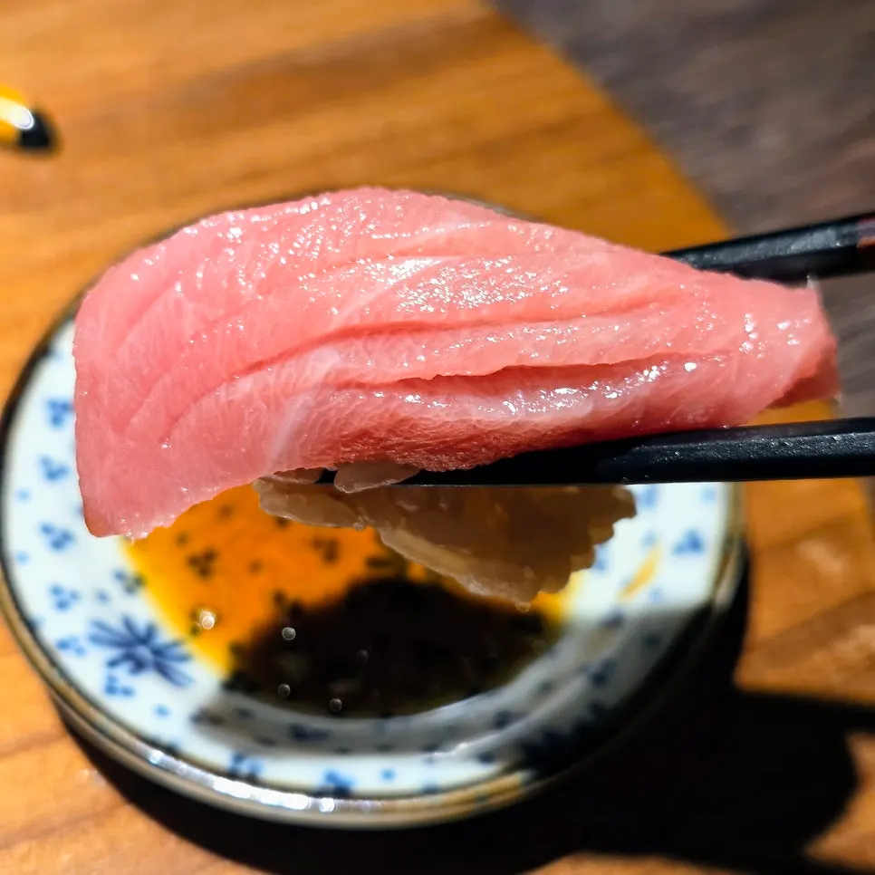 Negitoro sushi topped with sea tangle