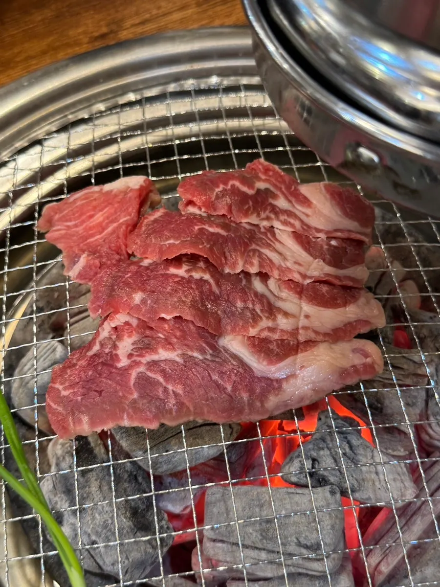 Beef cuts placed on the grill