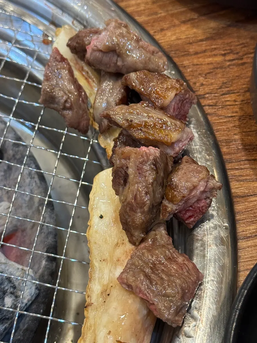 Grilled kkorbisal showing its distinct muscle grain