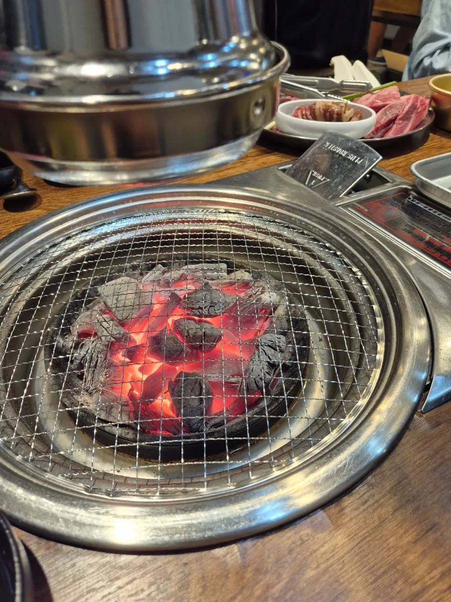 Seasoned LA galbi cooking on the grill