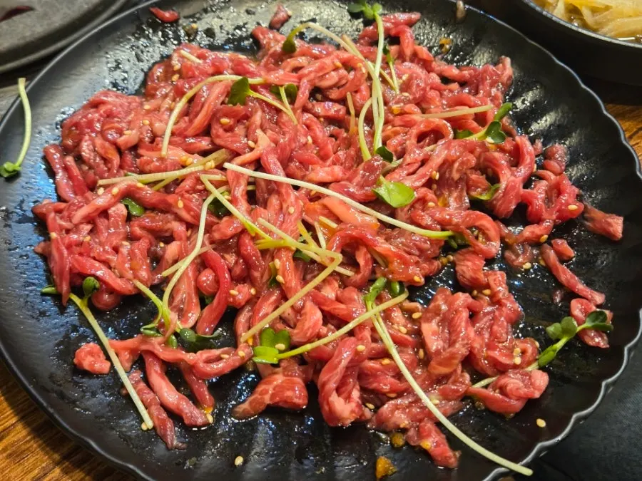 Close-up of red raw beef and egg yolk