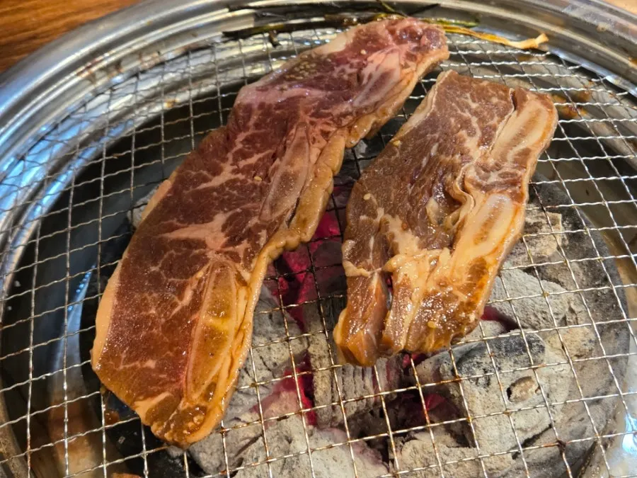 A full spread of marinated ribs and grilled beef