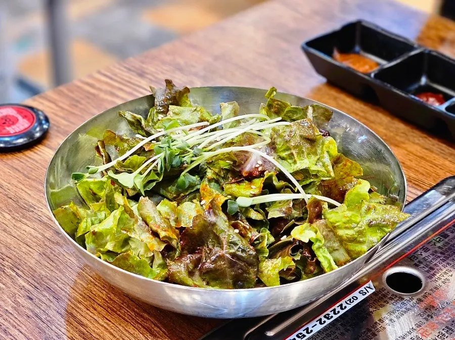 Nutty-smelling dressed lettuce salad