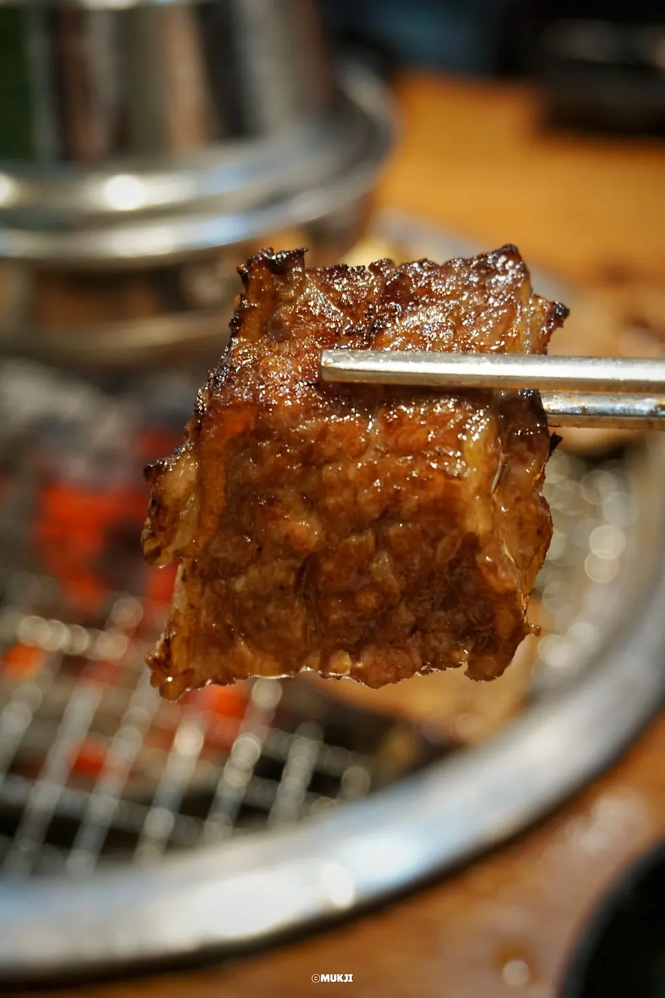 A fully grilled piece of galbisal off the charcoal