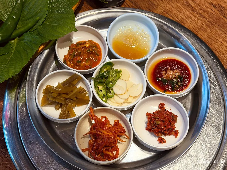 Herring roe and jeotgal side dishes served with perilla-leaf wraps