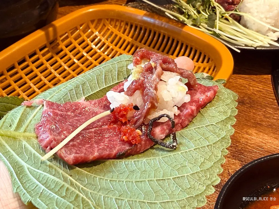 A small dish of mill-pressed sesame oil next to yuksashimi