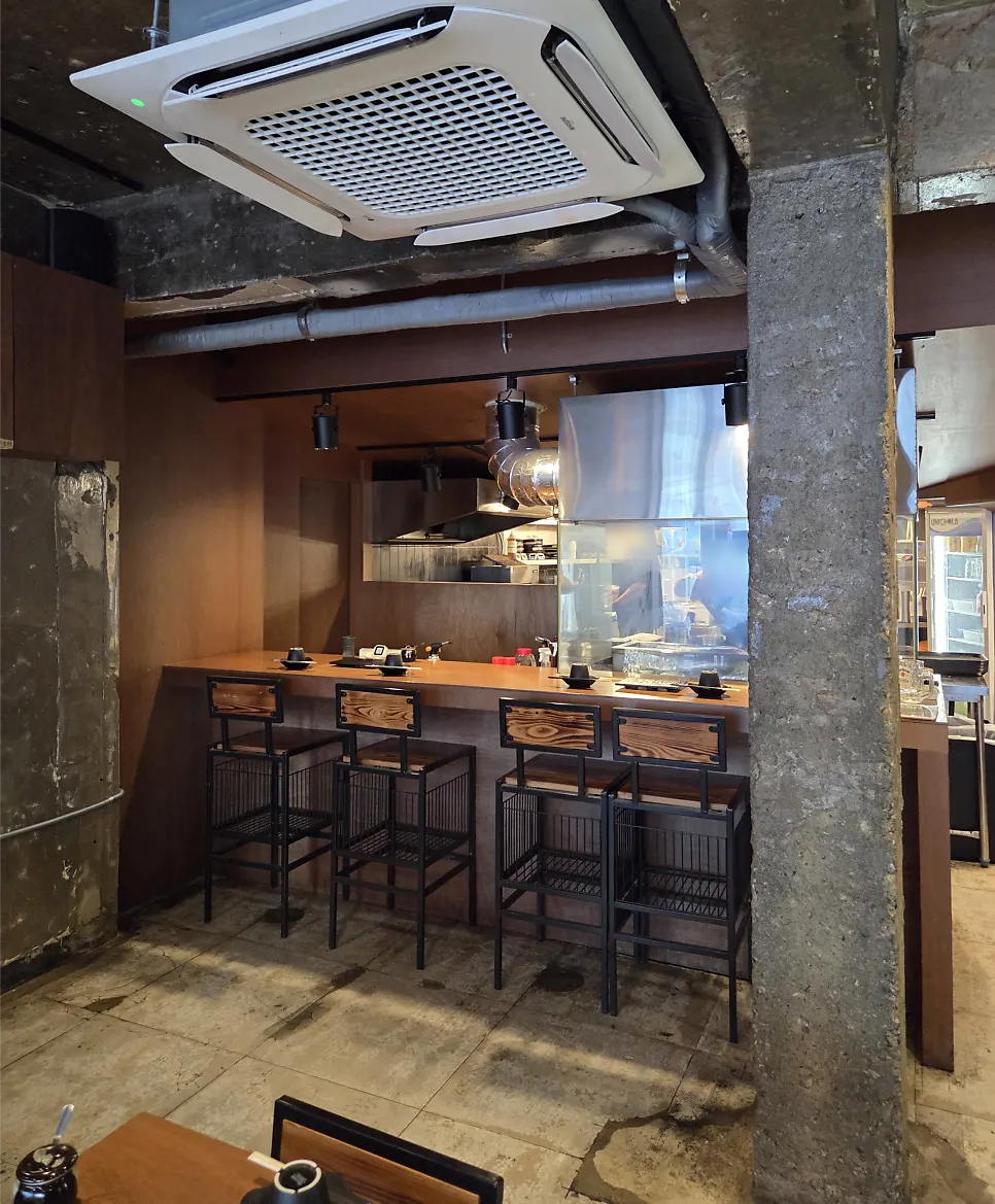 Charcoal brazier cooking in the open kitchen