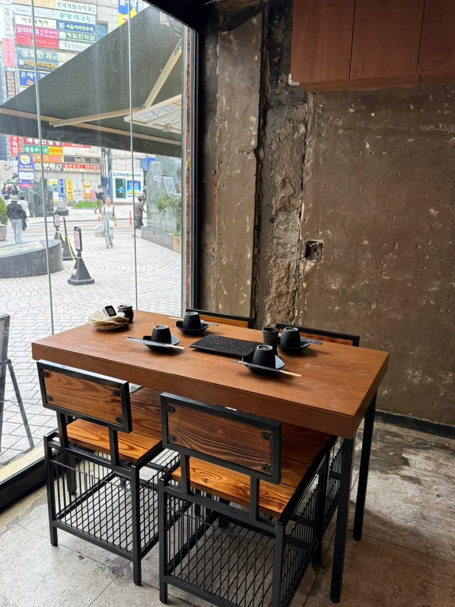 Seating and table at Yakitori Shomong Mapo Station Branch
