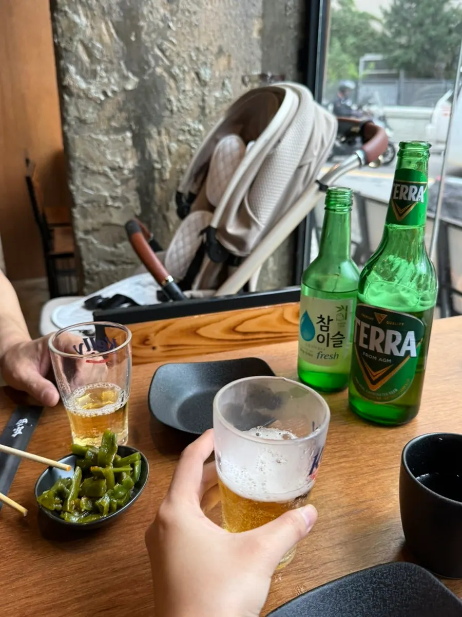 Soju and beer bottles on the table