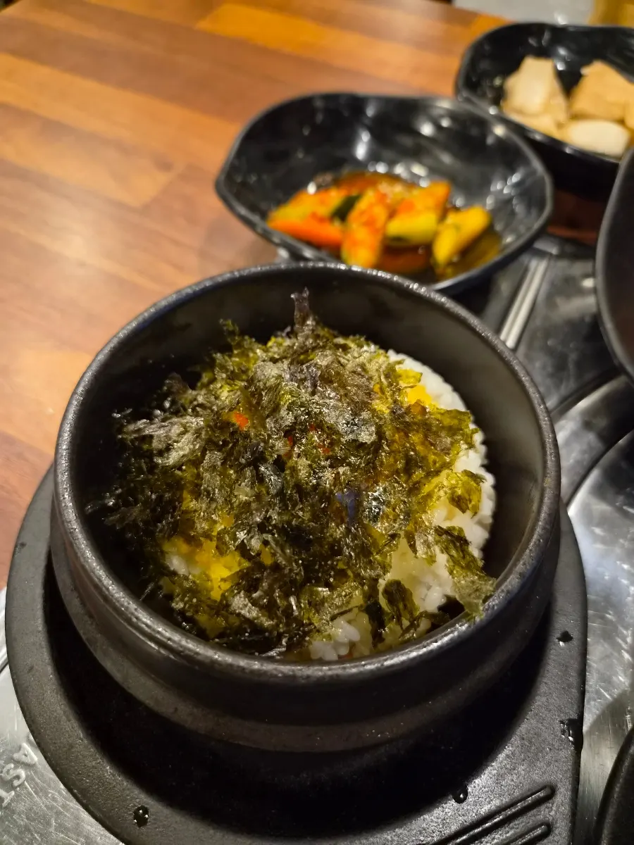Warm egg rice served alongside the course