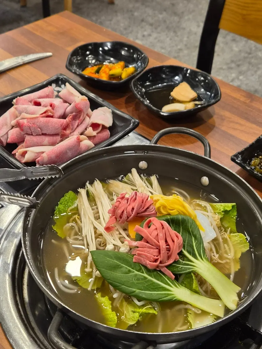 Table set with horse leg meat and vegetables for shabu-shabu