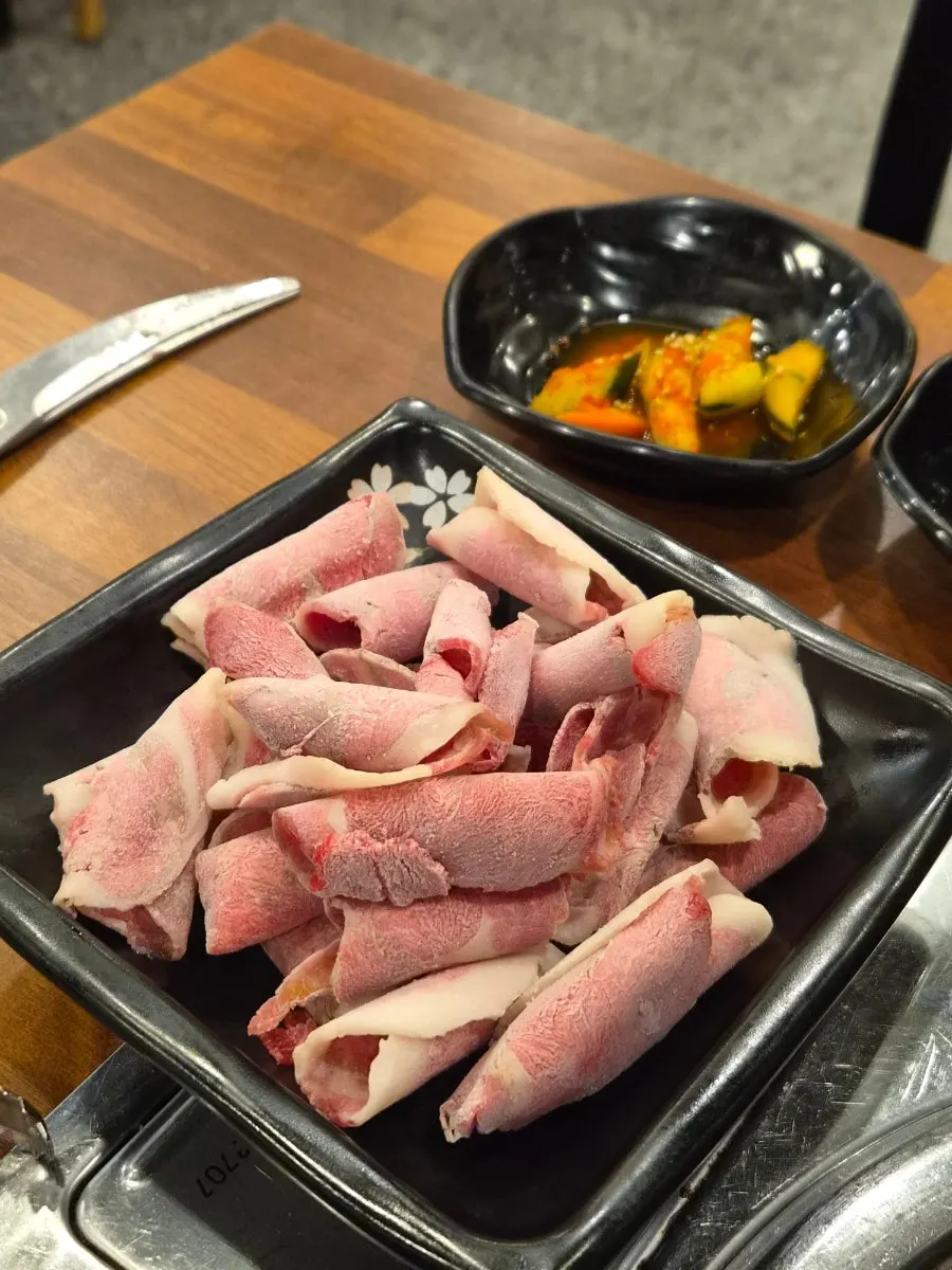 Shabu-shabu broth with prickly pear cactus and tangerine noodles