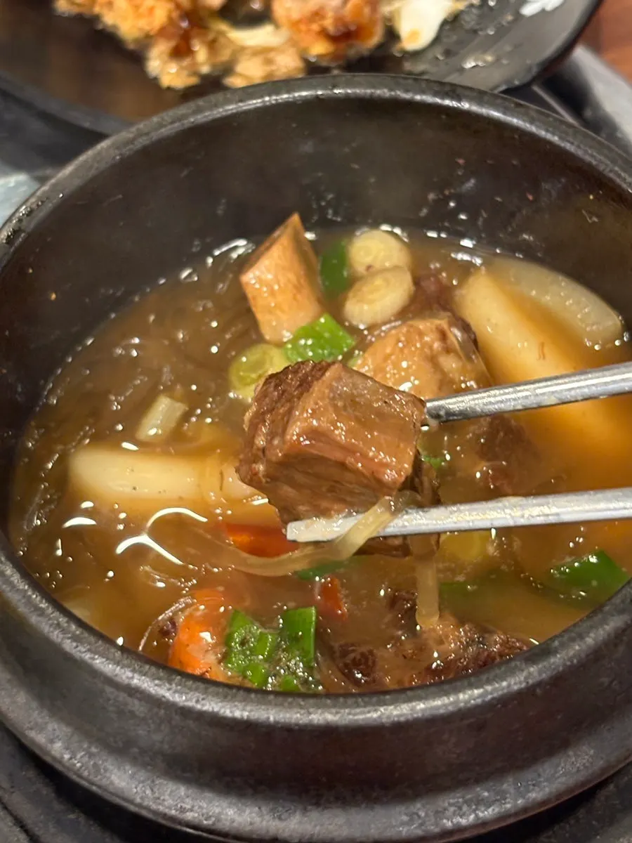 Close-up of braised horse ribs falling off the bone