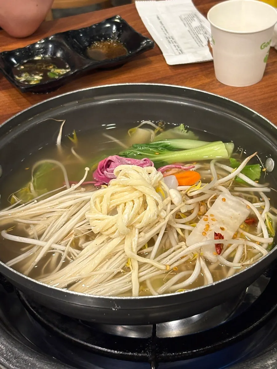 Horse meat and vegetable broth prepared for shabu-shabu