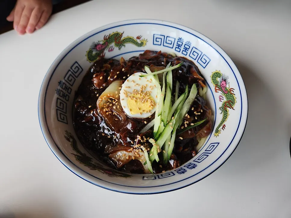 Table spread of jjamppong rice, jjajangmyeon and tangsuyuk
