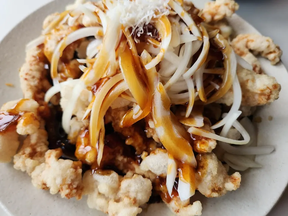 A small plate of black vinegar sirloin tangsuyuk