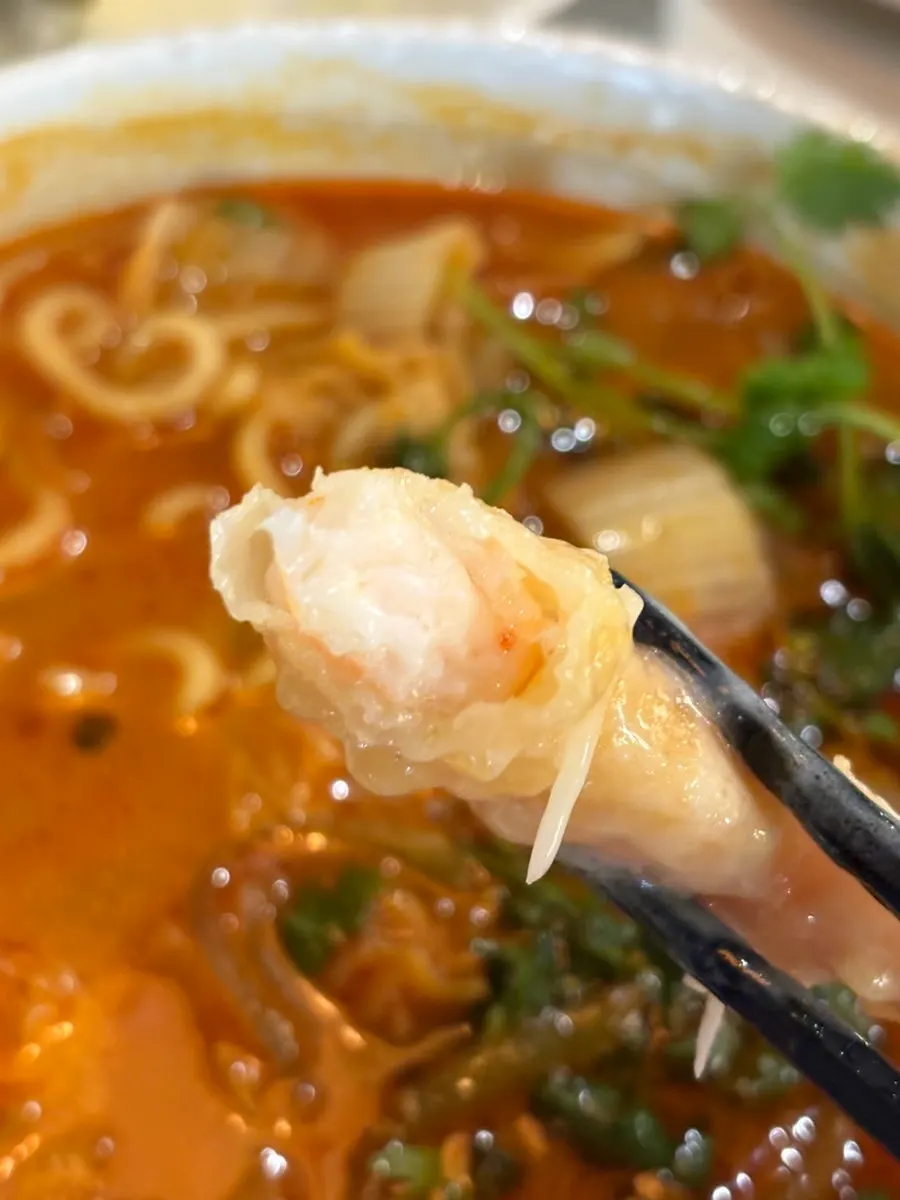 A bite of cream shrimp with jalapeño together