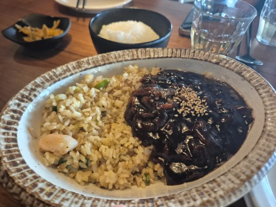 Tangsuyuk and noodle dishes served together