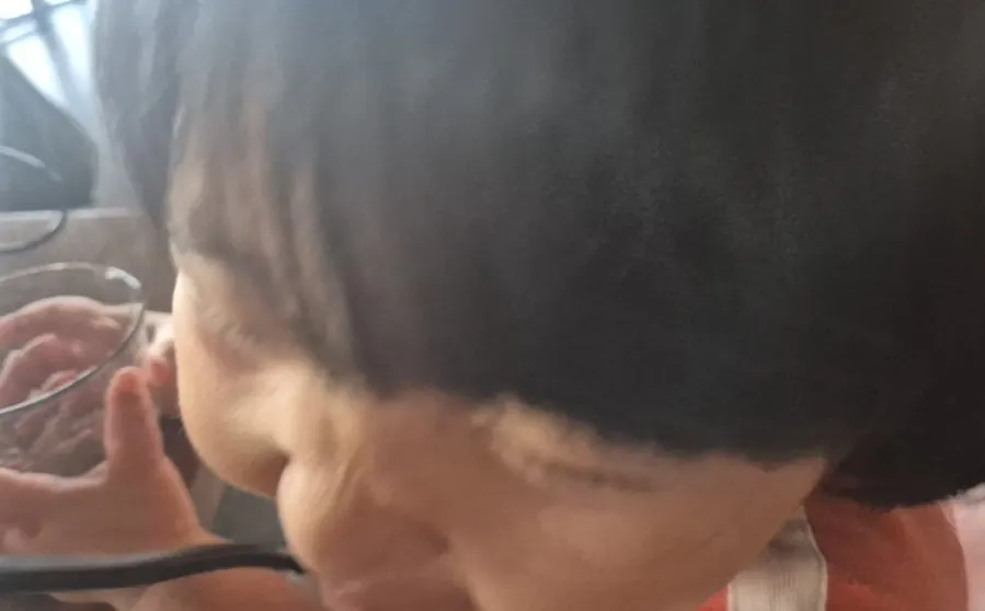 A child eating jajangmyeon enthusiastically
