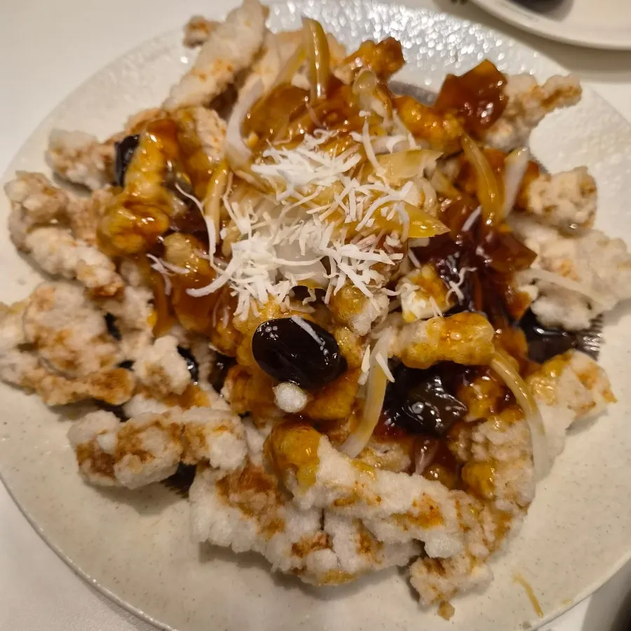 Cross-section of tangsuyuk coated in black vinegar sauce